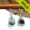 A perfect matched pair of beautiful seafoam green sea glass earrings combined with solid sterling sandollar charms and a setting that leaves much of the beauty of these sea glass pieces shine.
SOLD - Sorry these Sea Glass Earrings are NO LONGER AVAILABLE!