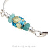 A detail of this bracelet shows you the unique vintage bead that is the focal point of this sea glass bracelet.