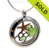 Genuine lime green and cobalt blue sea glass piece combined with a real starfish, a bit of vintage seafan and real beach sand in this stainless steel locket.
SOLD - Sorry this Sea Glass Locket is NO LONGER AVAILABLE!