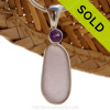 This beautiful Bright Perfect Purple sea glass piece is set in our Deluxe Wire Bezel© pendant setting with a genuine Amethyst brilliant cut gem.
Sorry this Sea Glass Jewelry selection has been SOLD!