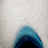 Closeup of blue pontil sea glass piece. You can see the telltale "C"'s that indicate top quality well aged sea glass.