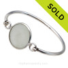 Genuine Sea Glass Bottle Stopper Top Bangle Bracelet set in our Deluxe Wire Bezel© sterling silver setting.
Sorry this Sea Glass Bracelet has been SOLD!