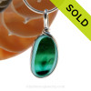 A beautiful piece of vivid teal green and bright aqua blue sea glass set for a necklace in our Original Sea Glass Bezel© in solid sterling silver setting.
Sorry this Ultra Rare Sea Glass Pendant has been SOLD!