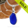 A curvy piece of Cobalt Blue Genuine Sea Glass with in our signature Original Wire Bezel© pendant setting in Sterling Silver.
Sorry this Sea Glass Jewelry selection has been SOLD!