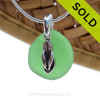 Seafoam Green sea glass set on a solid sterling cast bail with a sterling silver Flip Flop charm.
Sorry this sea glass necklace has been SOLD.