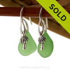 Natural bright green sea glass pieces are set with solid sterling palm tree charms and are presented on sterling silver fishook earrings.
SOLD - Sorry these Sea Glass Earrings are NO LONGER AVAILABLE!