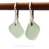 An irregular shaped natural sea glass earring pair.