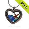 Cobalt Blue sea glass combined a large silver heart locket necklace.
Sorry this sea glass jewelry piece has been SOLD!