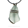 A simple and secure setting that leaves most of the sea glass pendant unaltered from the way it was found on the beach.