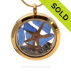 A gold tone stainless steel locket necklace with real blue beach found sea glass pieces and two real starfish!