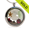 SOLD - Sorry This Sea Glass Jewelry Selection Is NO LONGER AVAILABLE!
A small seafoam green beach found sea glass, a real starfish, baby sandollar and genuine garnet gems in a stainless steel locket combined with Genuine Garnet gems.