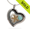 Aquamarine Beach Found  Sea Glass combined a silver Heart Locket necklace with Sandollar, Pearls and CZ Crystal Gems.
SOLD - Sorry This Sea Glass Jewelry Selection Is NO LONGER AVAILABLE!