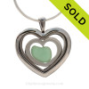 Aqua Green Sea Glass Heart inside a Heart Locket with Stainless Steel Heart.