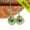 Small but perfect beach found green sea glass pieces are set with solid sterling sea shell charms and are presented on sterling silver fishook earrings.
SOLD - Sorry these Sea Glass Earrings are NO LONGER AVAILABLE!