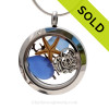 Pieces of Genuine Sea Glass in Blue , a real baby starfish, a bit of vintage sea fan and a Solid Sterling MOM charm completes this sea glass locket necklace.
SOLD - Sorry this Sea Glass Locket is NO LONGER AVAILABLE!