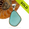 This is a beautiful LARGE P-E-R-F-E-C-T Vivid Bright Aqua Blue Sea Glass set in our Mixed Deluxe Tiffany Wire Bezel© pendant setting. This is our Deluxe Wire design that leaves the glass UNALTERED from the way it was found on the beach.
SOLD - Sorry this Rare Sea Glass Pendant is NO LONGER AVAILABLE!