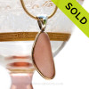 This small slice of peach sea glass is set in a mixed metal gold and sterling silver Deluxe Wire Bezel setting. Very Versatile and elegant. CLASSIC!
This setting leaves this amazing natural sea glass piece just the way it was found on  the beach!
SOLD - Sorry this Ultra Rare Sea Glass Pendant is NO LONGER AVAILABLE!