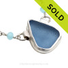 A Perfect piece of Periwinkle or Carolina Blue sea glass from set in an artisan fine and sterling silver backed bezel necklace.
Presented on a fine sterling silver aquamarine and pearl chain.
SOLD - Sorry this  Rare Sea Glass Necklace is NO LONGER AVAILABLE!