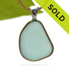 This is a beautiful large  Paler Aqua Green Genuine Sea Glass set in our Mixed Deluxe Tiffany Wire Bezel© pendant setting .