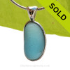 A Lovely Jellybean Shaped Stormy Blue Seaham sea glass set in Sold Sterling Silver Deluxe Wire Bezel© pendant setting.
SOLD - Sorry this Rare Sea Glass Pendant is NO LONGER AVAILABLE!