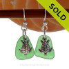 Natural beach found green sea glass pieces are set with solid sterling Sea Turtle charms and are presented on sterling silver fishook earrings.

SOLD - Sorry these Sea Glass Earrings are NO LONGER AVAILABLE!