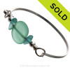 Two nice pieces of aqua green Hawaiian Sea Glass with Vivid Blue lampwork Glass Beads on this Solid Sterling Silver half round Sea Glass Bracelet.
SOLD - Sorry this Sea Glass Bracelet is NO LONGER AVAILABLE!