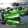 Many green sea glass pieces start out as soda or beer bottles broken on the beach.