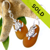 Perfect amber brown sea glass pieces set with solid sterling sea turtle charms on a medium size earring.