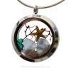 Genuine Carolina Blue sea glass pieces combined with a two real starfish and crystal gems for multi month stainless steel locket.