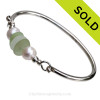 White and Seafoam Green Sea Glass pieces on this Solid Sterling Silver Full round Sea Glass Bangle Bracelet with real Cultured Freshwater Pearls,
SOLD - Sorry this Sea Glass Bangle Bracelet is NO LONGER AVAILABLE!