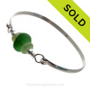 3 Pieces of Genuine Sea Glass in stunning Greens on this Solid Sterling  Half Round Bangle Bracelet.
SOLD - Sorry this Sea Glass Bangle Bracelet is NO LONGER AVAILABLE!