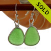 Larger Perfectly matched Vivid green beach found Sea Glass Earrings set in our signature Original Wire Bezel© setting in silver.
SOLD - Sorry these Sea Glass Earrings are NO LONGER AVAILABLE!