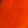 A macro CloseUp detail of one of the orange red Sea Glass Earrings.