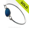 Genuine Sea Glass Bangle Bracelet in a ELECTRIC Mixed Aqua Blue set in our Deluxe Wire Bezel© sterling silver setting.