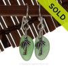 Beach found green sea glass pieces are set with solid sterling pal tree charms and are presented on sterling silver fishook earrings.
SOLD - Sorry these Sea Glass Earrings are NO LONGER AVAILABLE!