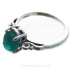 A very nice piece of vivid teal or turquoise green beach found sea glass set in a solid sterling silver scroll ring.