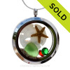 Green sea glass and a real starfish and Sandllar make this a great locket necklace for the holidays.
Ruby Red AND Peridot Green crystal gems finish the locket with some extra bling.
SOLD - Sorry this Sea Glass Locket is NO LONGER AVAILABLE!