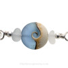 A detail of the top quality genuine sea glass pieces and the lovely handmade light blue wave bead.