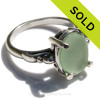 A stunning and lovely piece of NATURAL beach found Fresh Seafoam Green sea glass securely set in a solid sterling silver scroll ring. 
Seafoam sea glass is considered mid rare and is becoming increasingly hard to find as each tide passes.
This amazing vivid sea glass piece hails from Puerto Rico and is UNALTERED from  the way it was found on the beach.