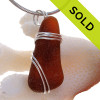 A top quality piece of Perfect Amber Brown Genuine Sea Glass in a simple secure sterling triple pendant setting for a necklace.