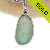 This is a soft subtle mixed of  Green end of day Sea Glass in a Pendant In Original Wire Bezel Setting©