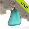 This is a beautiful Deep Vivid Aqua Blue Genuine Sea Glass set in our Original Wire Bezel© pendant setting in 14K Goldfilled