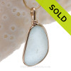 This is a LARGE and THICK Baby Blue Genuine Sea Glass set in our Original Wire Bezel© pendant setting in 14K Rolled Gold.