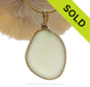 A lovely thick naturally aged pure Pale Butter Yellow natural sea glass piece set in our Original Wire Bezel setting in 14K Rolled Gold setting.