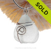 This natural sea glass piece is Pure Bright White Genuine Sea Glass In Sterling Sea Swirl Setting Pendant for Necklace.