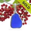 A PERFECT neat shaped naturally aged and Stunning Blue sea glass set in our Original Wire Bezel© necklace pendant. This original signature By The Sea setting encases the glass in silver and leaves both front and back open so you can feel the texture of this antique top quality glass.

This setting also leaves the glass just the way it was found on the beach.