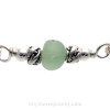 A detail of this Sea Glass Bracelet showing the lovely color in the English Sea Glass piece and the lovely dolphin beads.