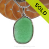 A Classic Green beach found sea glass set in our signature Original Wire Bezel© pendant setting in Solid Sterling Silver.