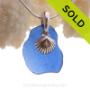 A beautiful beach found Cobalt Blue Sea Glass Necklace set on a solid sterling cast bail with a sterling silver shell charm.