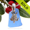 Nice Blue beach found sea glass combined with a solid sterling sea turtle charm and presented on a solid Sterling silver snake chain.